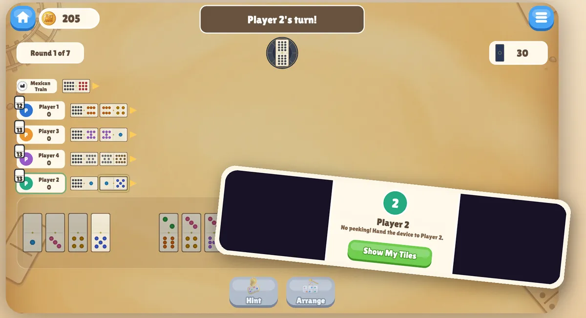 Pass & Play mode in Mexican Train Dominoes: a hand-off screen reading "Player 2 — no peeking! Hand the device to Player 2" covers the tiles until the next player taps Show My Tiles